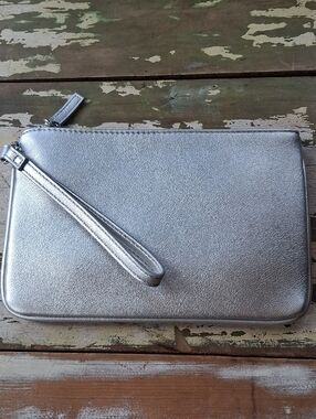 Express Silver Wristlet With Black Quilted Interior Lining